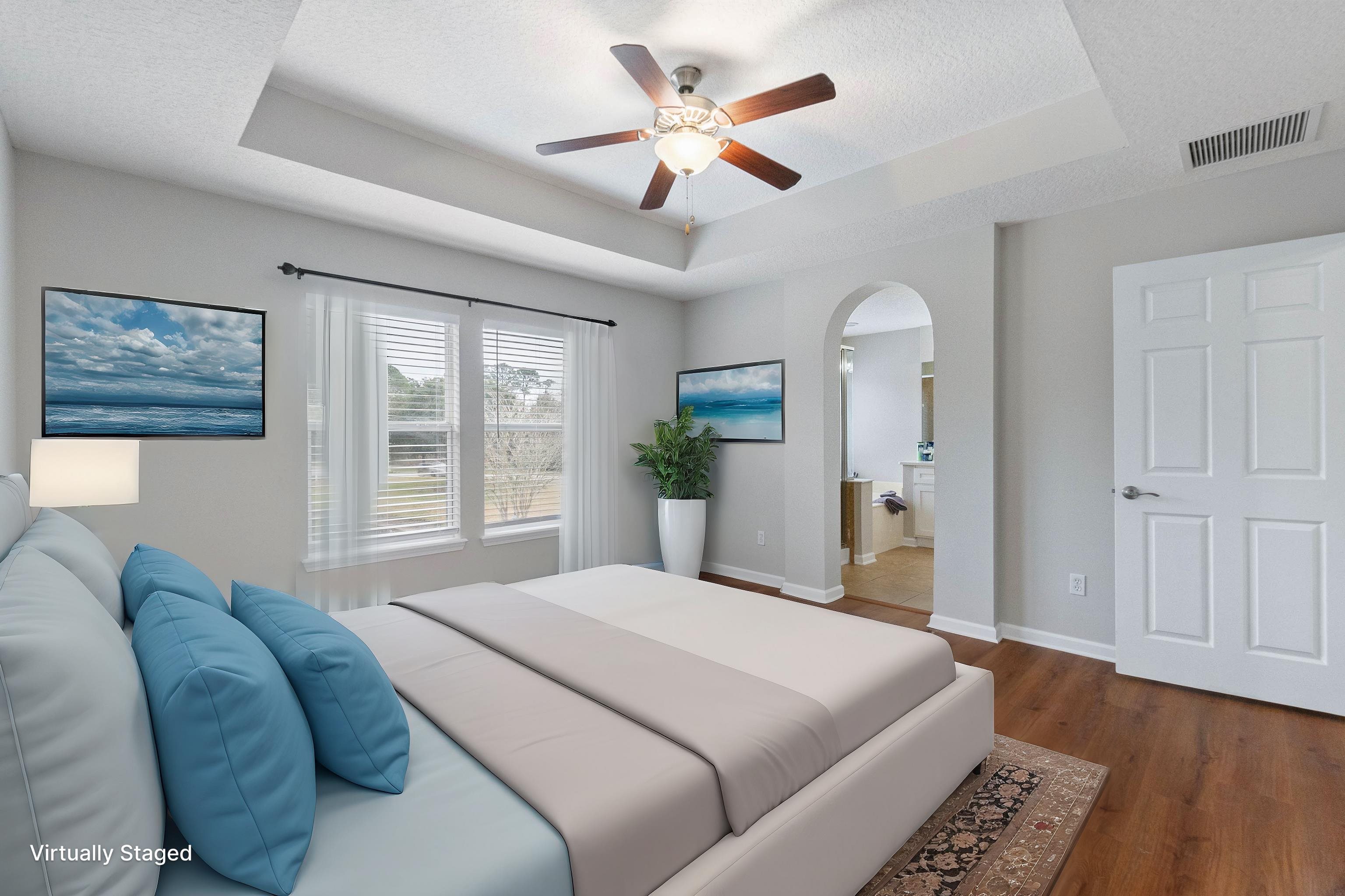 18 Amistad Drive St. Augustine, FL 32086 - Photo 36 of 37 a bedroom with a large bed and a chandelier fan