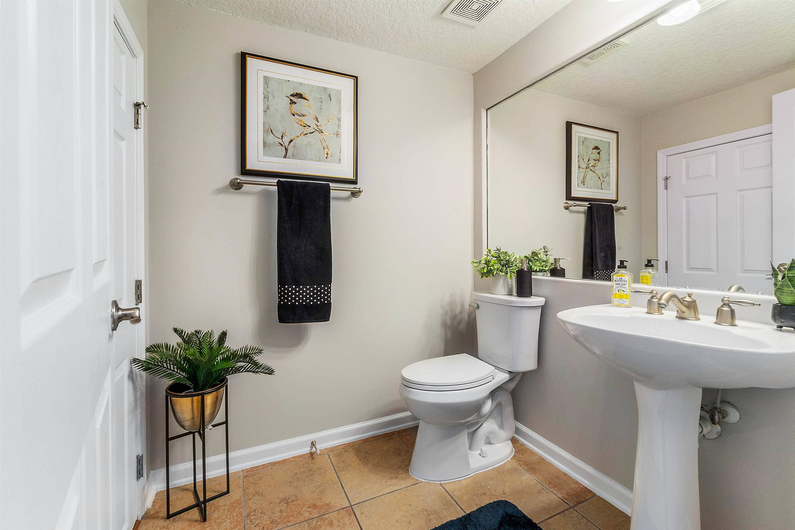 18 Amistad Drive St. Augustine, FL 32086 - Photo 5 of 37 a bathroom with a toilet a sink and mirror