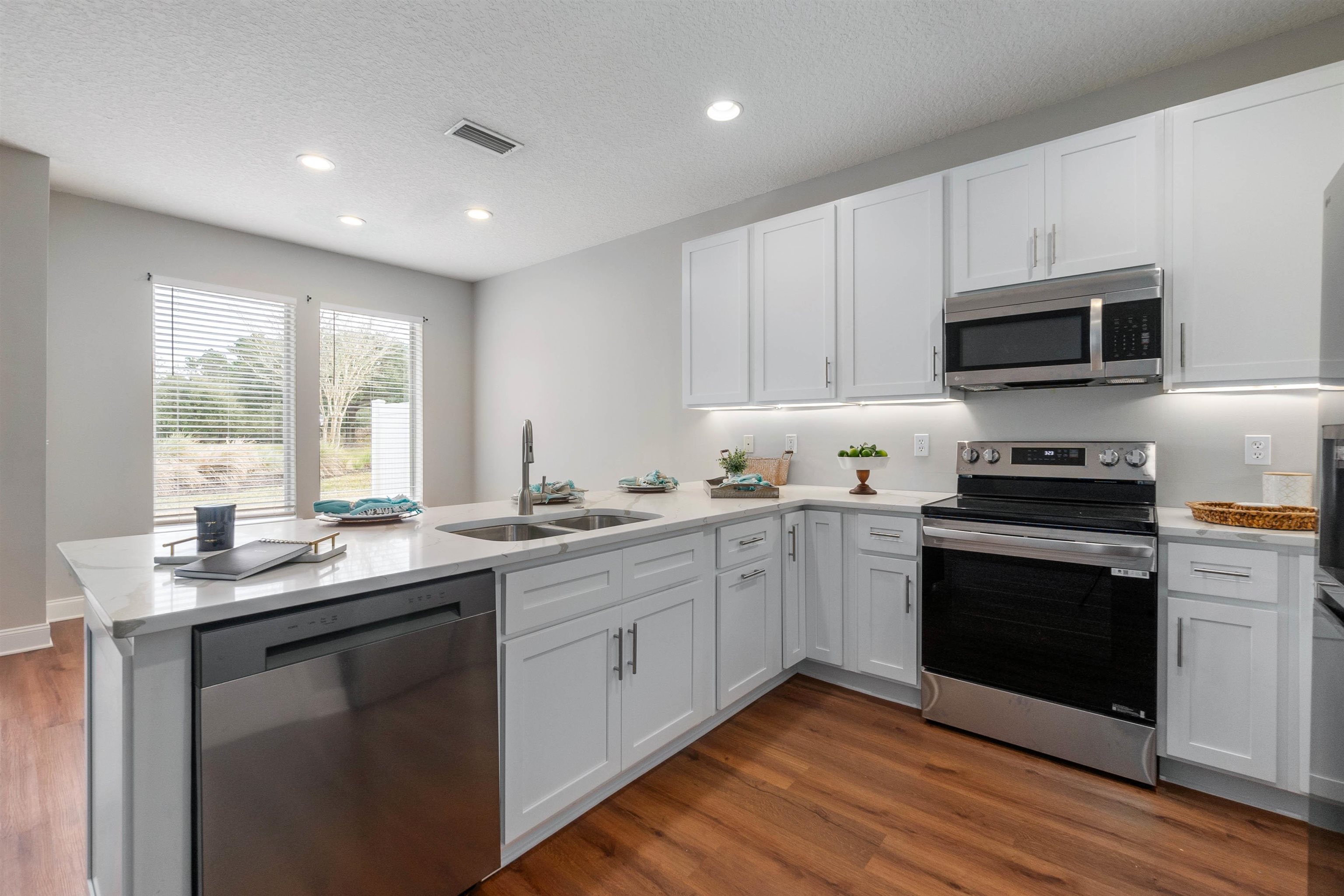 18 Amistad Drive St. Augustine, FL 32086 - Photo 10 of 37 a kitchen with a sink stove and microwave
