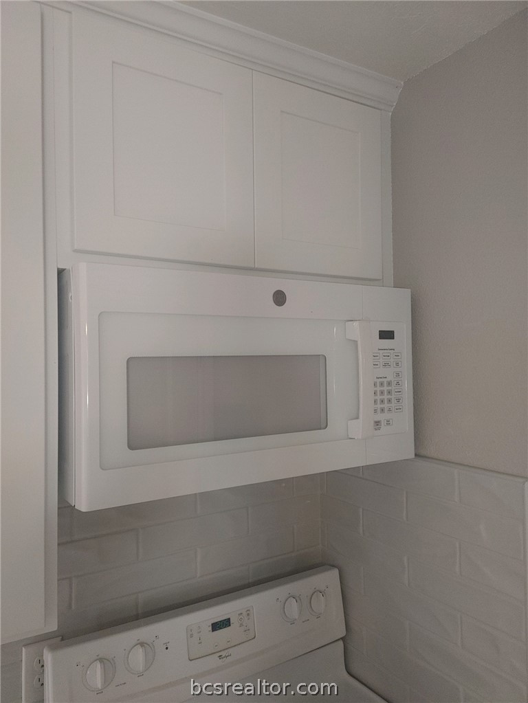4212 Old College Road, Unit 3 Bryan, TX 77801 - Photo 3 of 9 a bathroom with a sink and a mirror