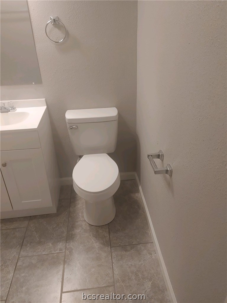4212 Old College Road, Unit 3 Bryan, TX 77801 - Photo 7 of 9 a bathroom with a toilet