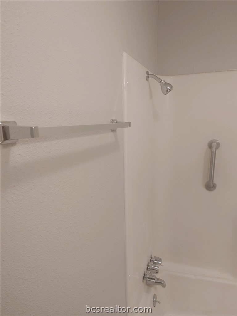 4212 Old College Road, Unit 3 Bryan, TX 77801 - Photo 8 of 9 a bathroom with a shower