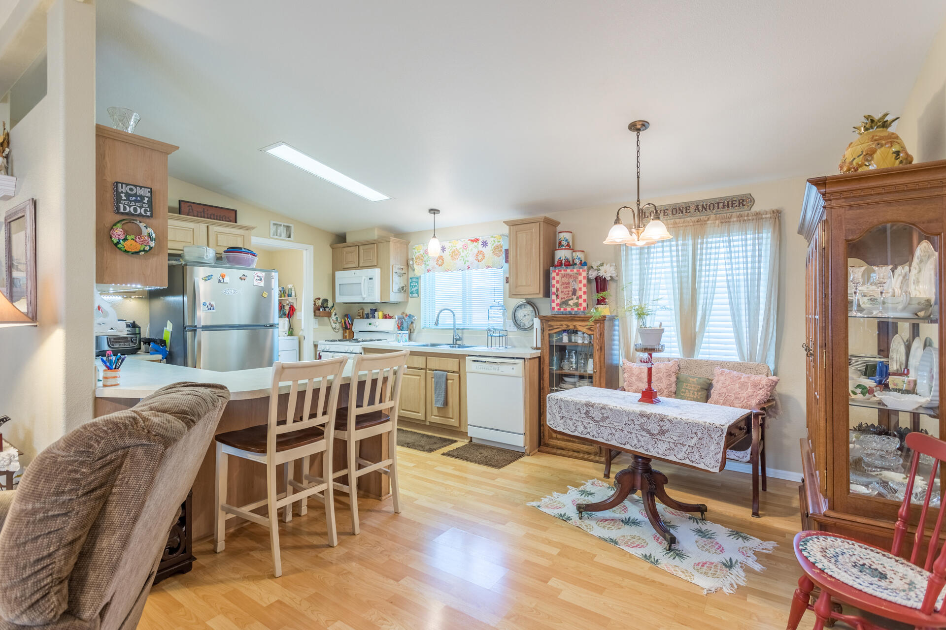 4696 Maple Trail, Unit LOS ROBLES ESTATES Redding, CA 96003 - Photo 10 of 33 a dining room with furniture and window