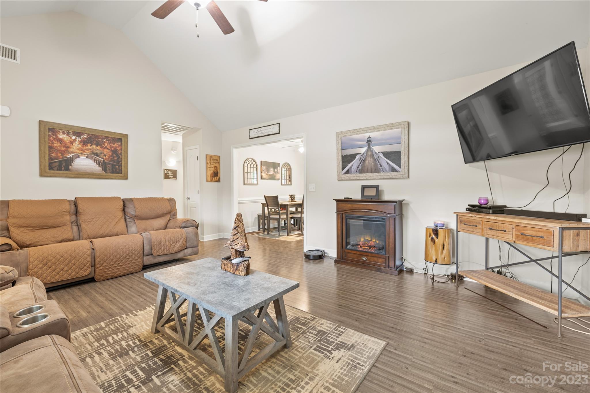 308 Fleetwood Road York, SC 29745 - Photo 8 of 25 a living room with furniture a fireplace and a flat screen tv