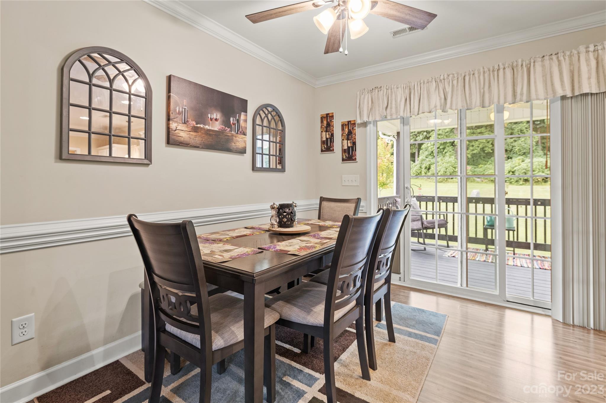 308 Fleetwood Road York, SC 29745 - Photo 10 of 25 a view of a dining room with furniture a chandelier and wooden floor