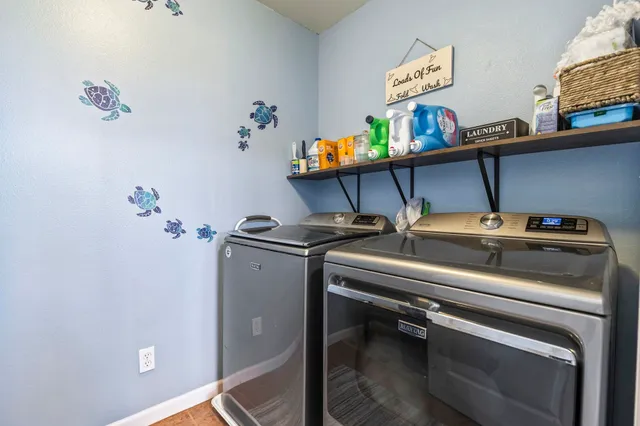 a view of a chairs and table in a balcony