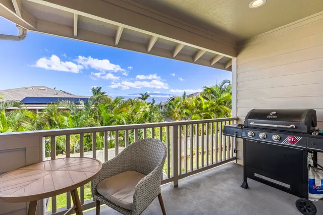 a view of a chairs and table in the balcony