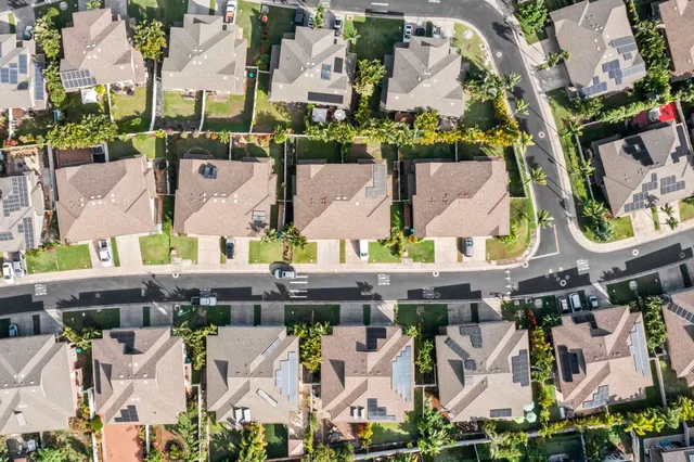 an aerial view of residential houses with outdoor space