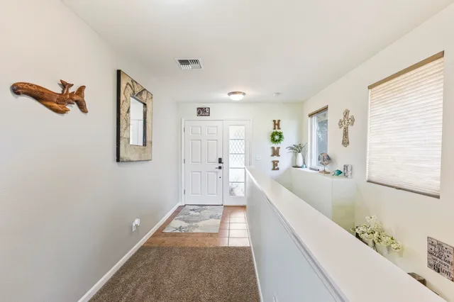 a spacious bathroom with a tub sink and mirror