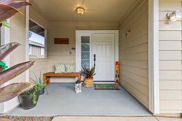 a backyard of a house with sofas