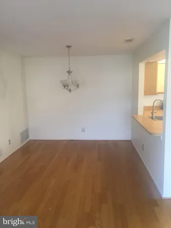 a view of a kitchen with a sink and dishwasher