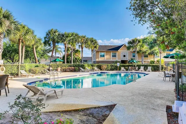 a kitchen with a refrigerator and a sink
