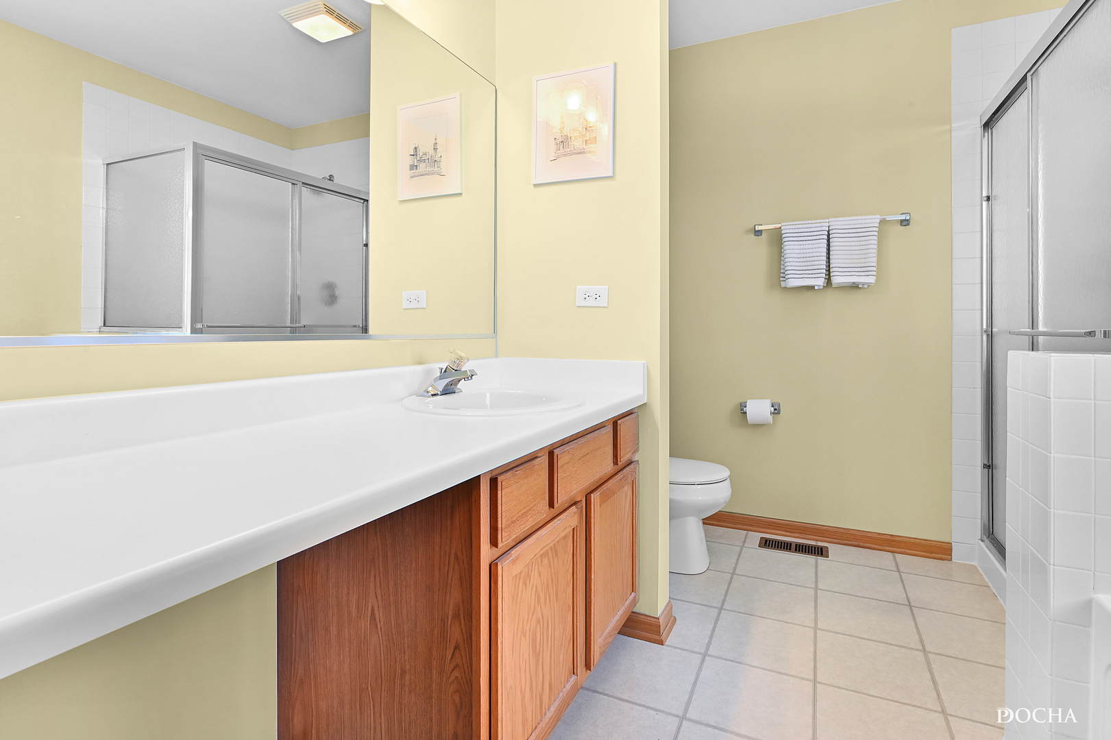 1809 Golden Gate Lane Naperville, IL 60563 - Photo 17 of 25 a bathroom with a sink a toilet and shower