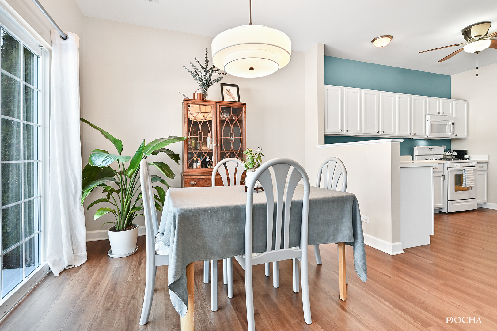 1809 Golden Gate Lane Naperville, IL 60563 - Photo 6 of 25 a view of a dining room with furniture window and wooden floor