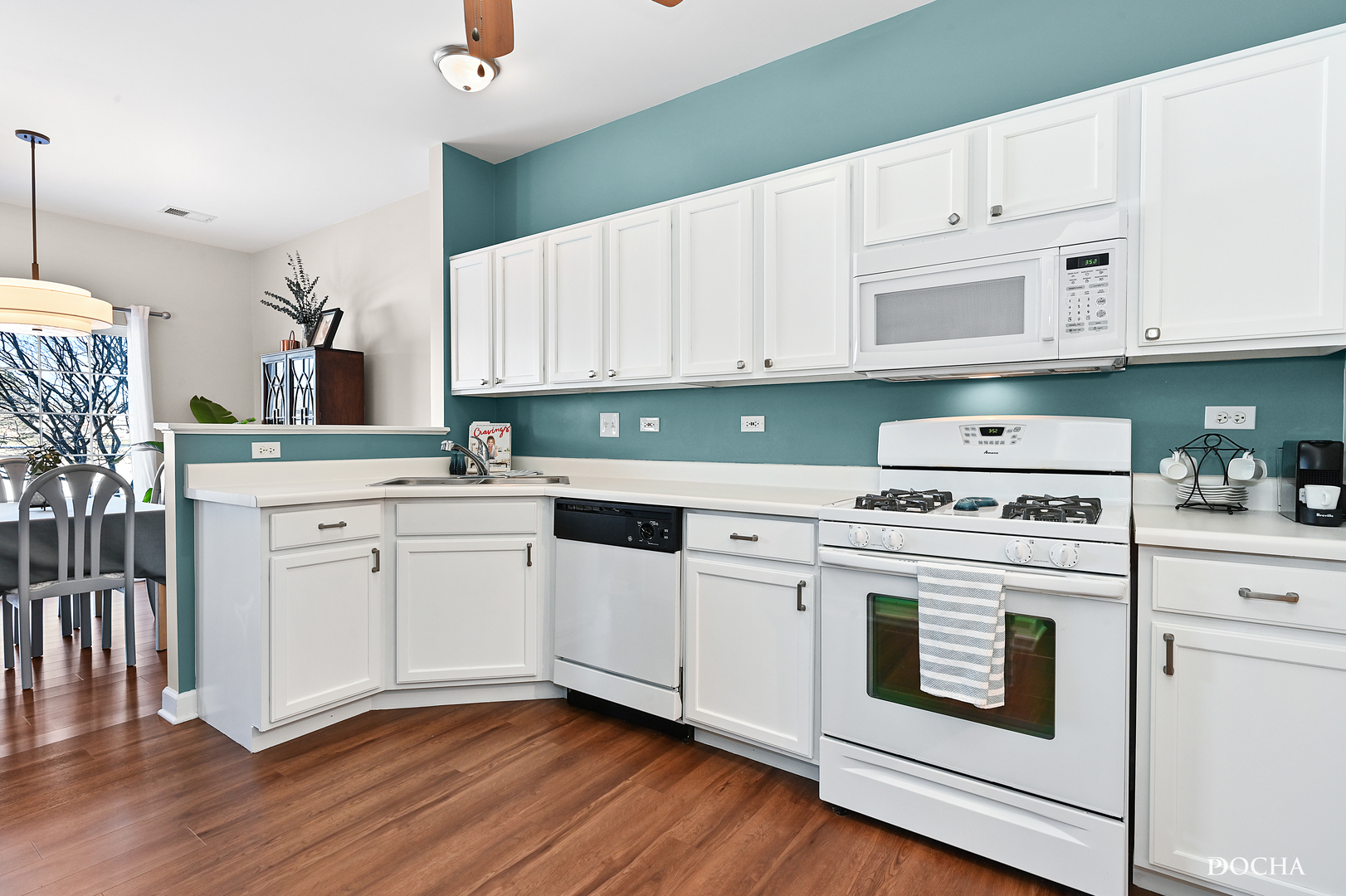 1809 Golden Gate Lane Naperville, IL 60563 - Photo 7 of 25 a kitchen with white cabinets sink and white appliances