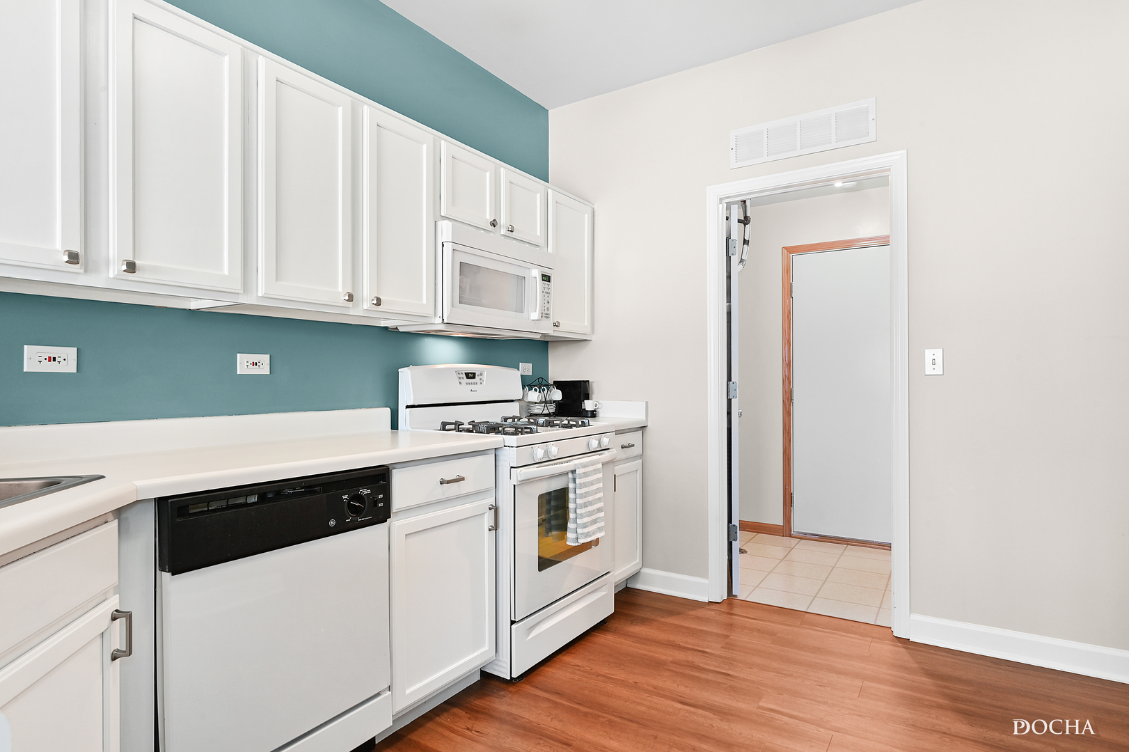 1809 Golden Gate Lane Naperville, IL 60563 - Photo 8 of 25 a kitchen with white cabinets and white appliances