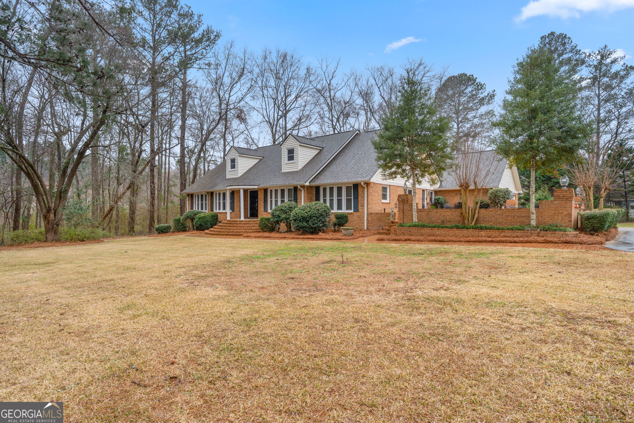 a front view of a house with a yard