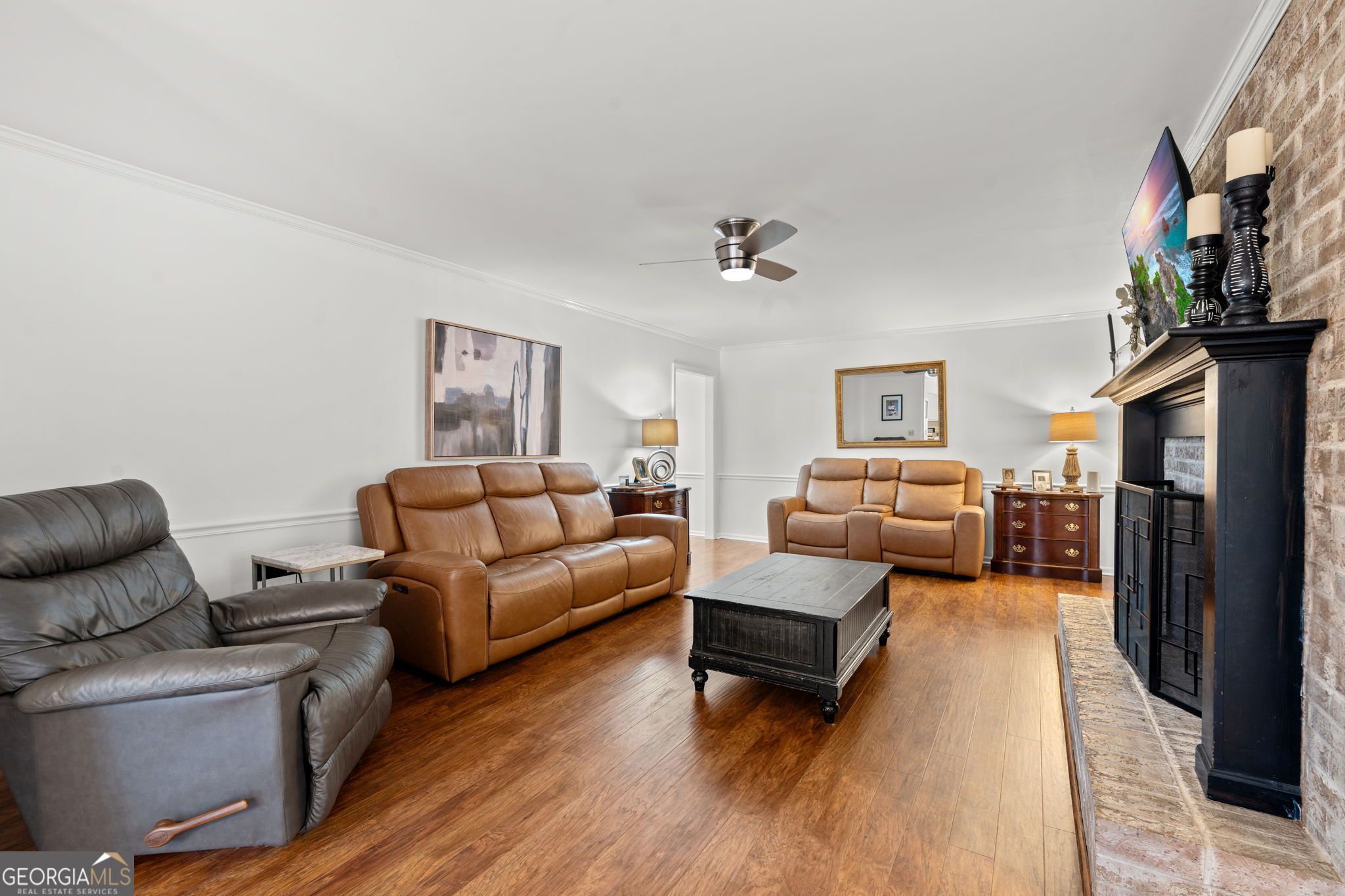 732 Bass Road Macon, GA 31210 - Photo 20 of 57 a living room with furniture and a wooden floor