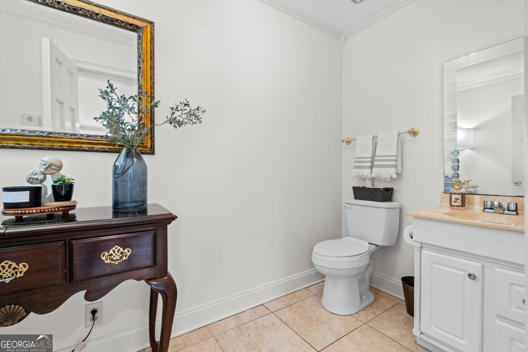 732 Bass Road Macon, GA 31210 - Photo 25 of 57 a bathroom with a toilet a sink and mirror