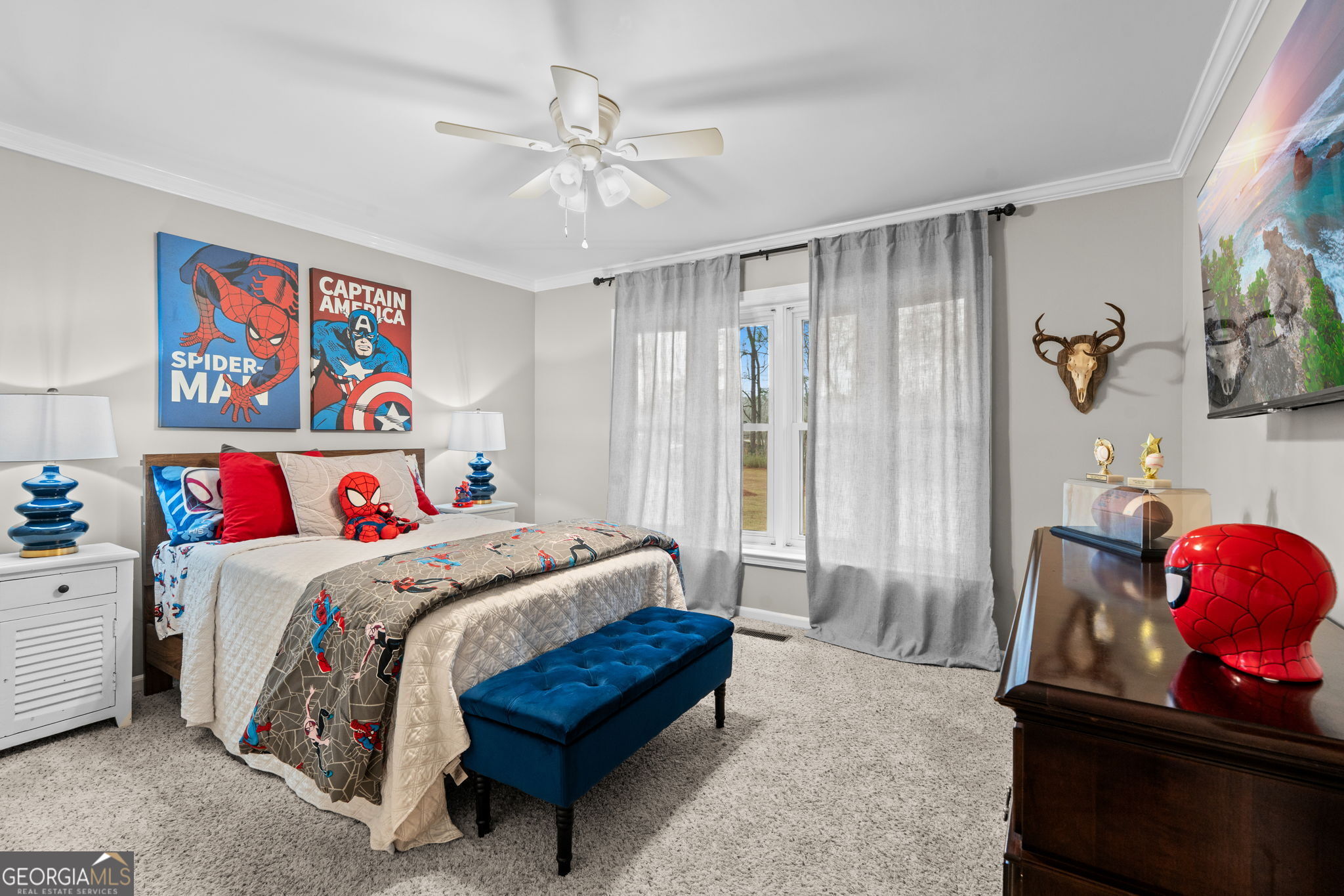 732 Bass Road Macon, GA 31210 - Photo 28 of 57 a bedroom with a bed and a chandelier