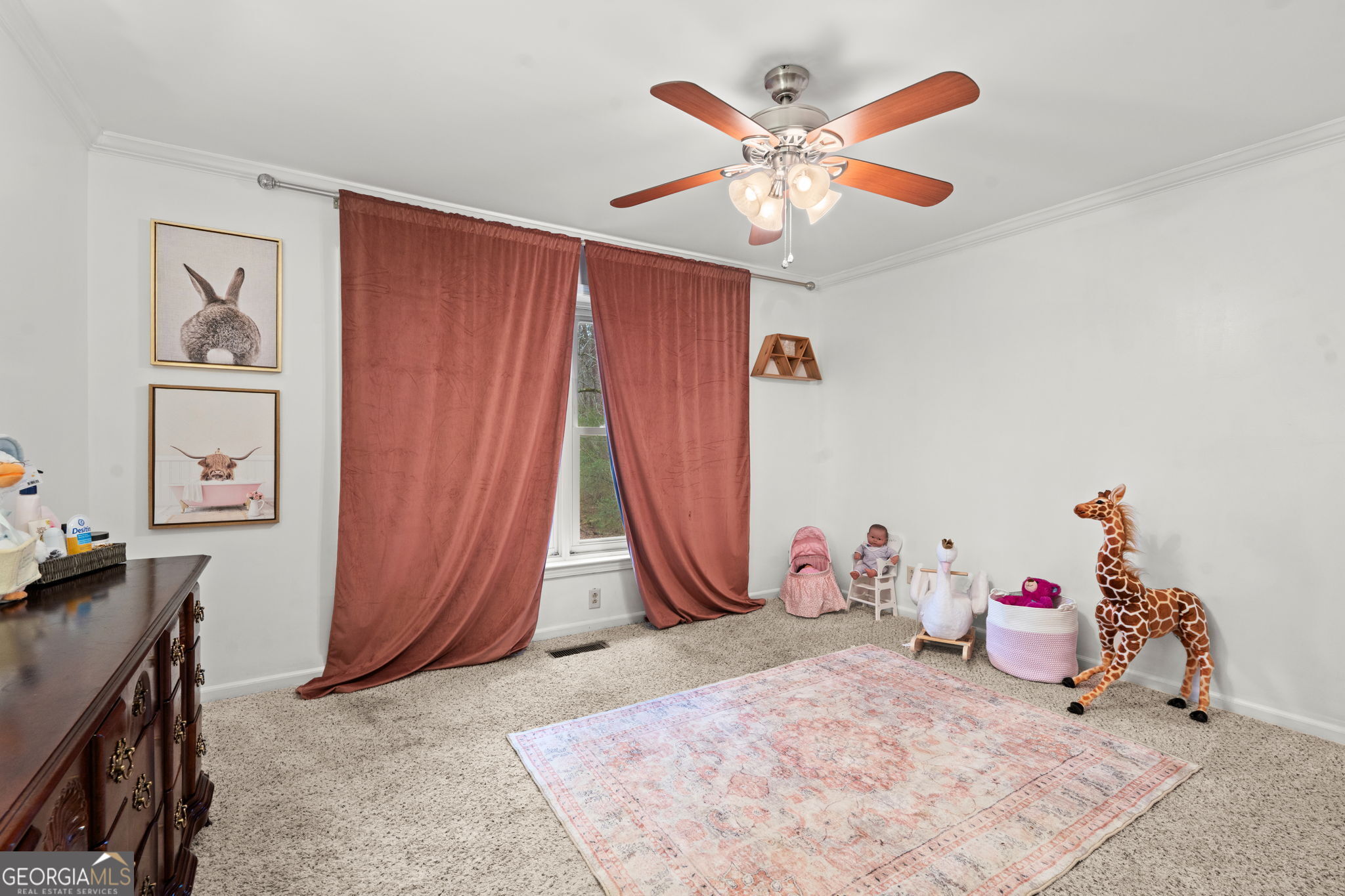 732 Bass Road Macon, GA 31210 - Photo 29 of 57 a room with a bed and a chandelier