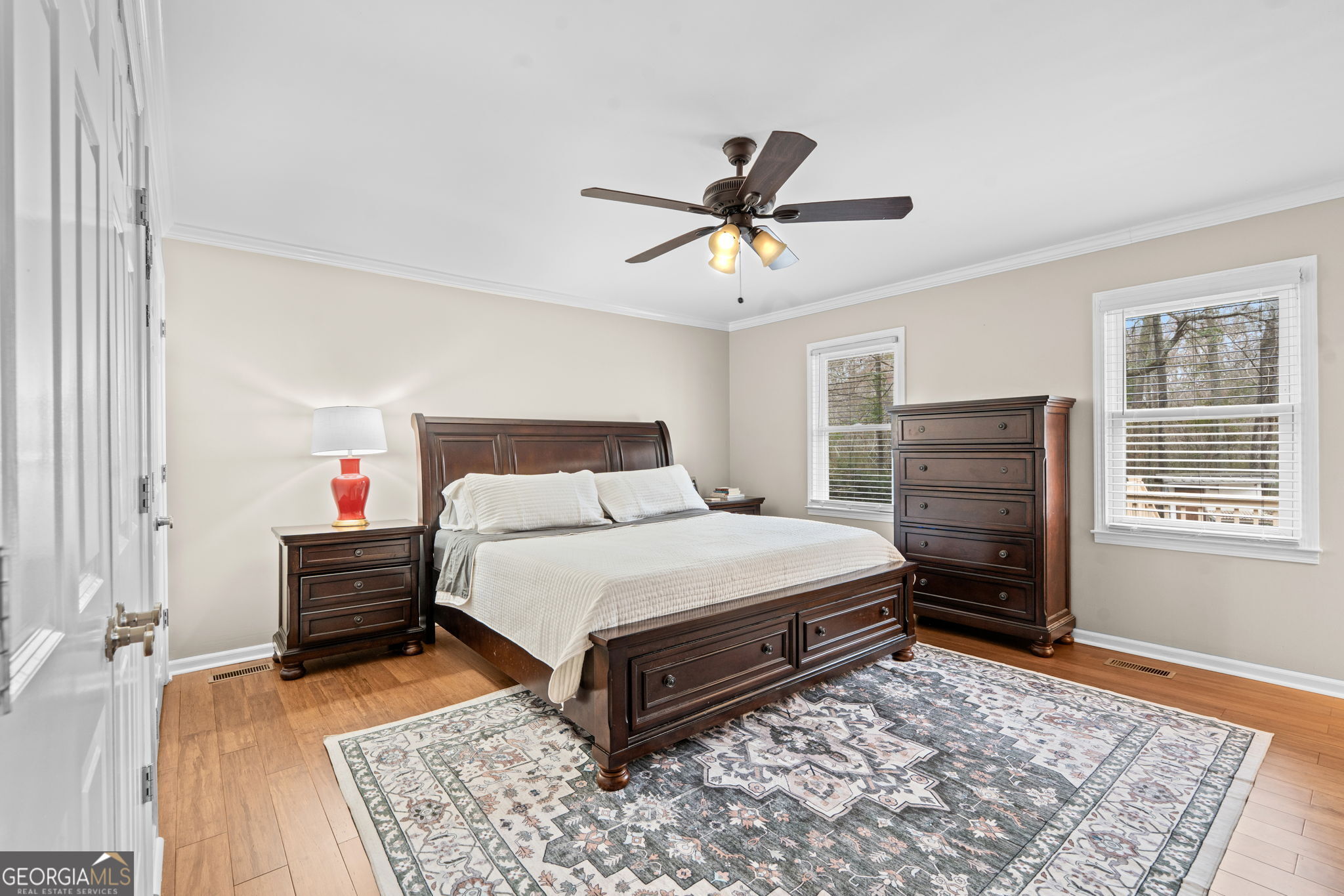 732 Bass Road Macon, GA 31210 - Photo 31 of 57 a bedroom with a bed and wooden floor