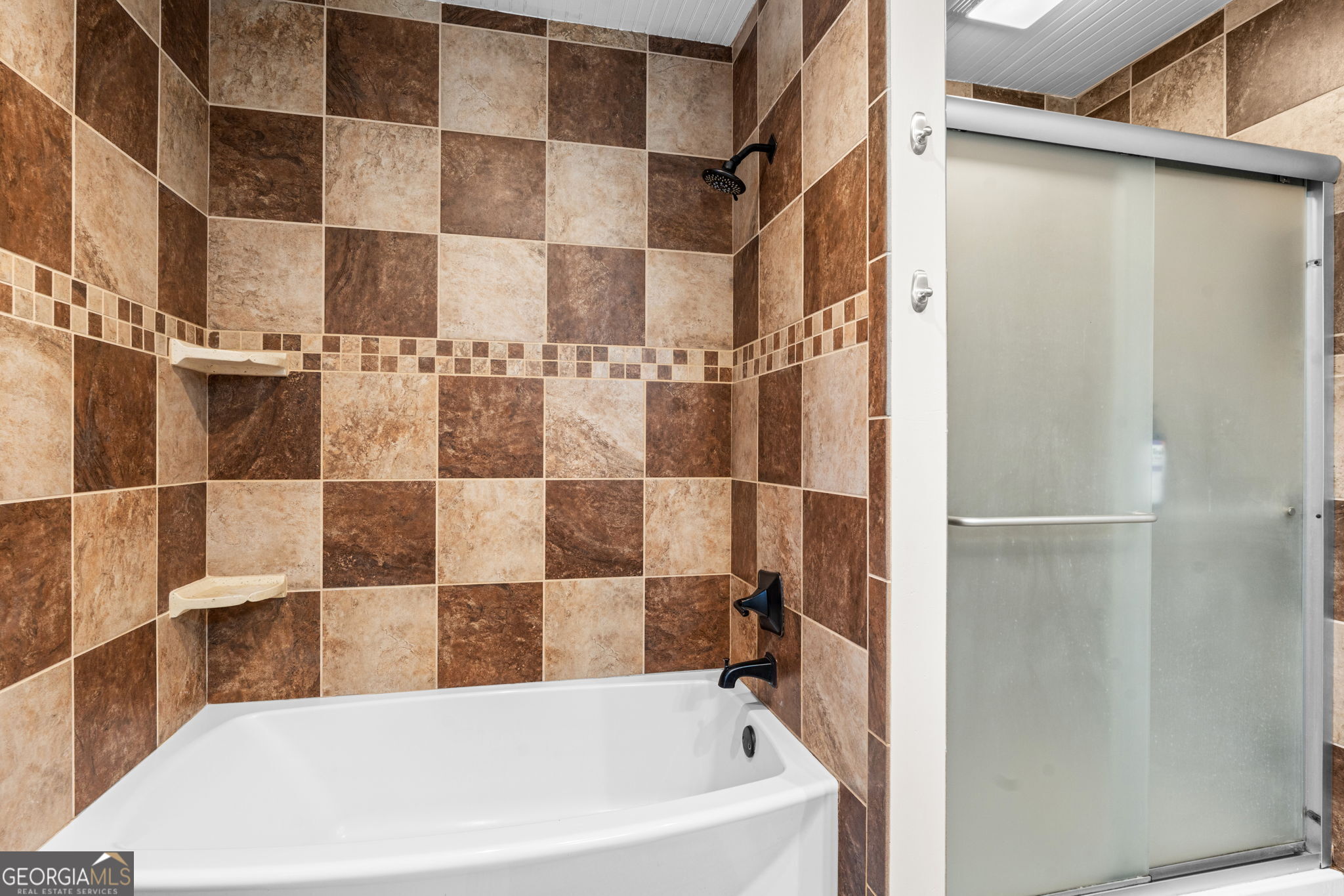 732 Bass Road Macon, GA 31210 - Photo 35 of 57 a bathroom with a bathtub and shower