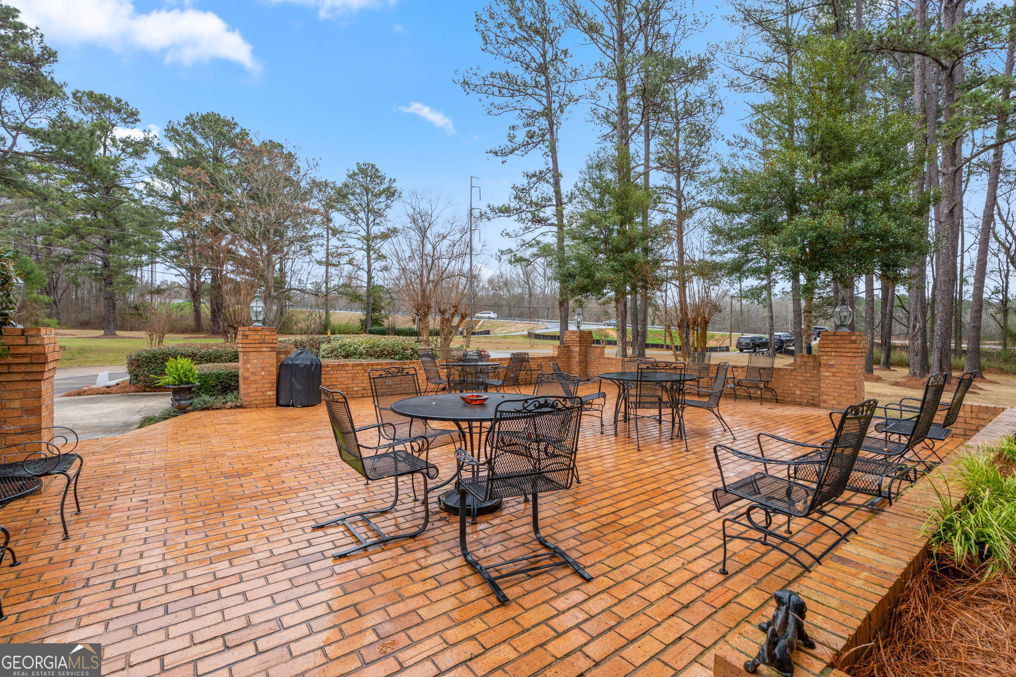 732 Bass Road Macon, GA 31210 - Photo 57 of 57 a view of a patio with dining table and chairs with wooden floor and fence