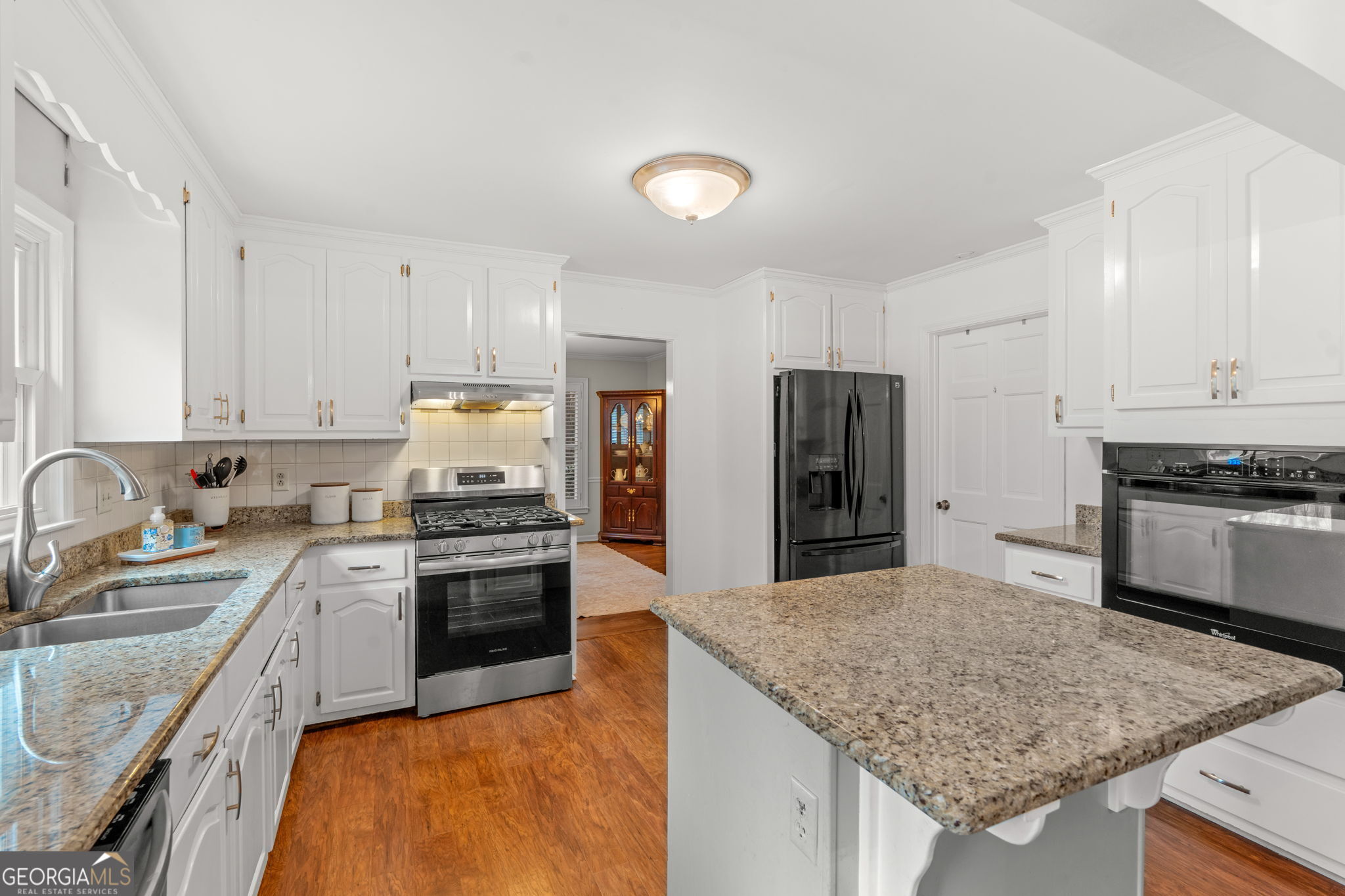 732 Bass Road Macon, GA 31210 - Photo 8 of 57 a kitchen with stainless steel appliances granite countertop a sink stove and refrigerator