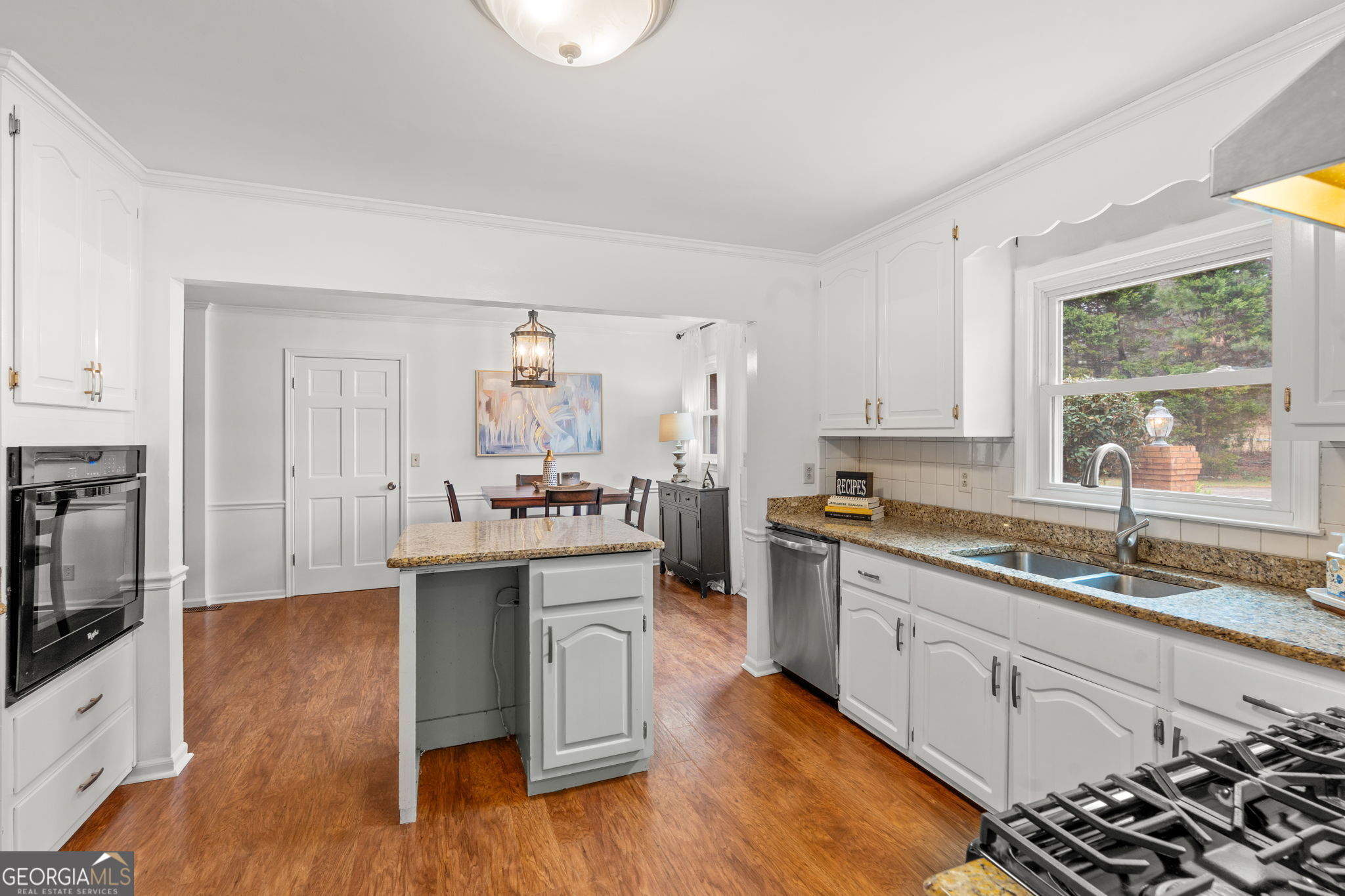732 Bass Road Macon, GA 31210 - Photo 9 of 57 a kitchen with a sink cabinets and wooden floor