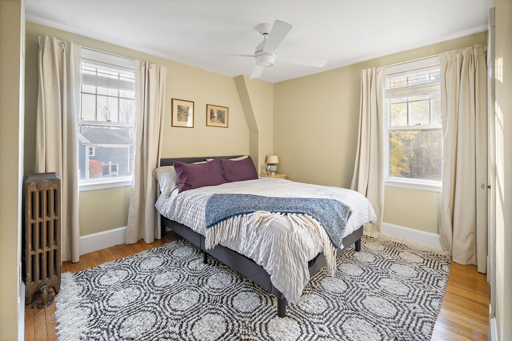 49 Cottage Street Sharon, MA 02067 - Photo 14 of 26 a bedroom with a large bed and a window