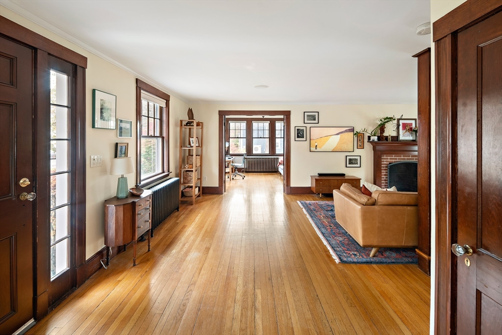 49 Cottage Street Sharon, MA 02067 - Photo 4 of 26 a living room with furniture and a wooden floor