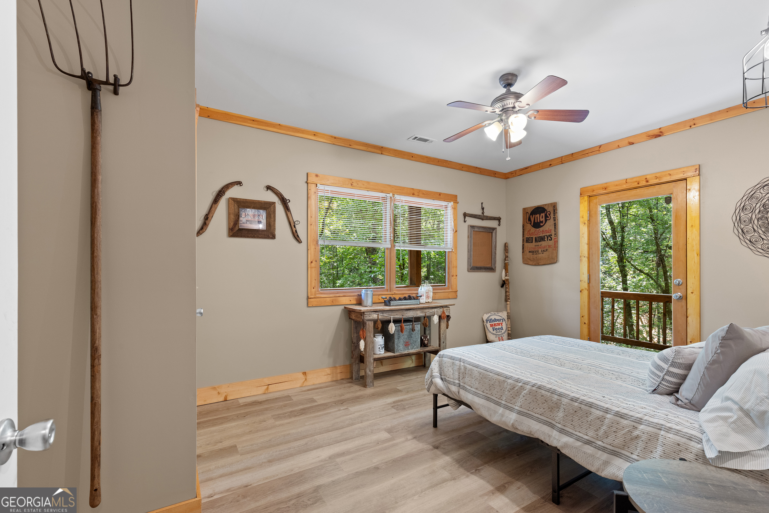 224 Dragon Tree Lane Lakemont, GA 30552 - Photo 19 of 38 a bedroom with a bed and a table with wooden floor