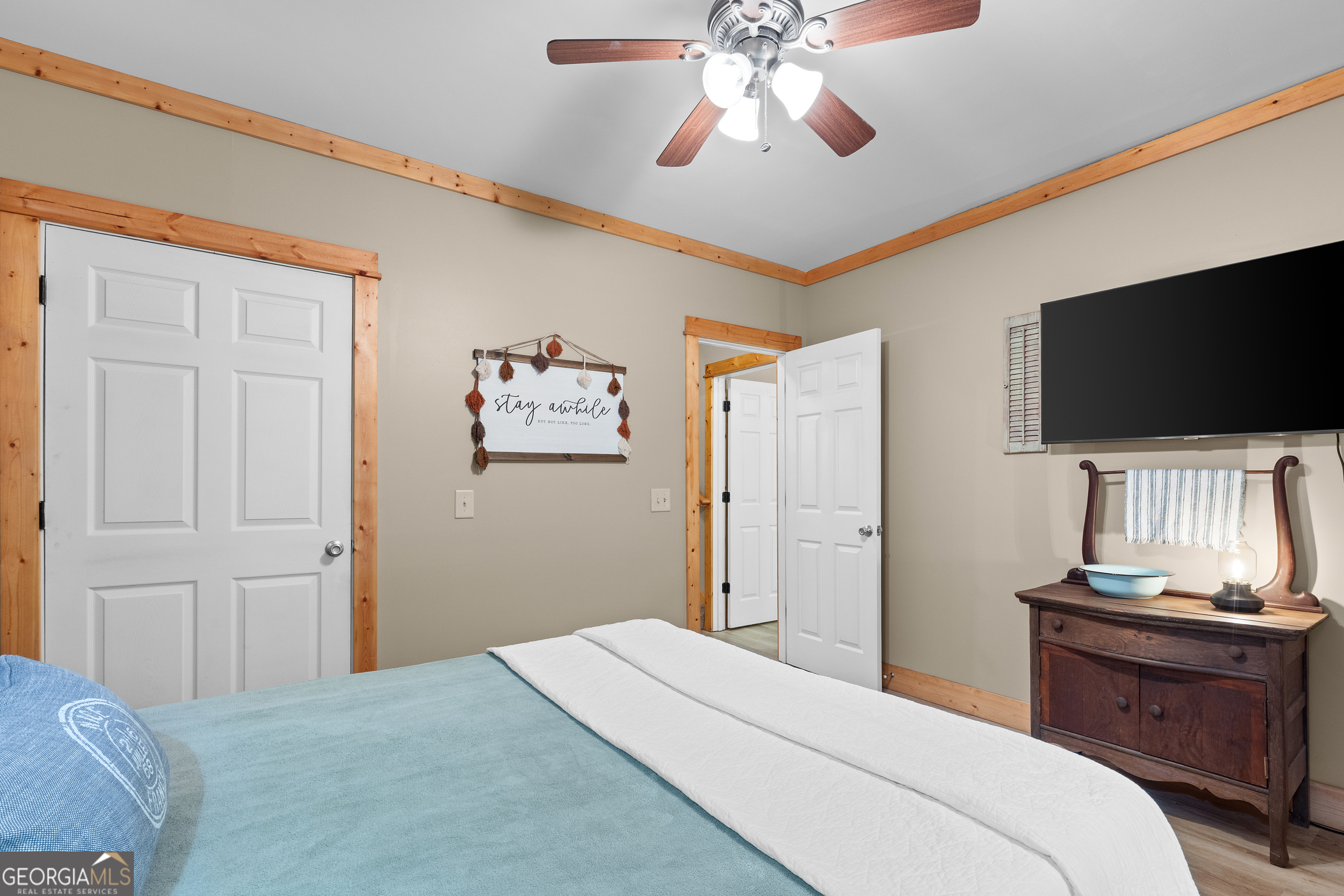 224 Dragon Tree Lane Lakemont, GA 30552 - Photo 22 of 38 a bedroom with a bed and a flat screen tv