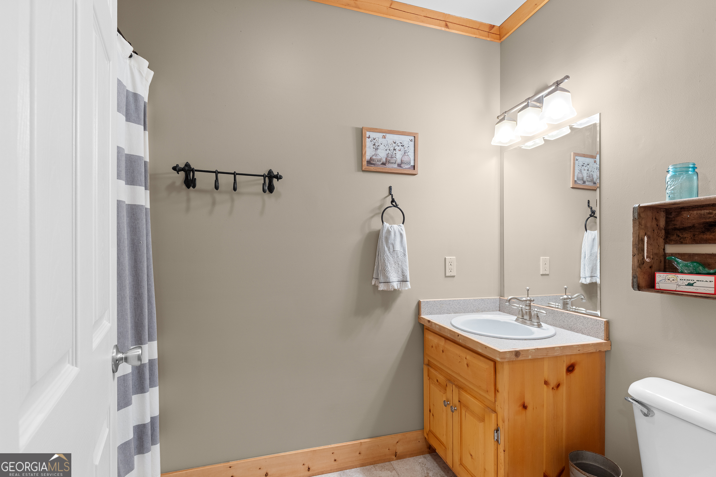 224 Dragon Tree Lane Lakemont, GA 30552 - Photo 23 of 38 a bathroom with a double vanity sink and a mirror