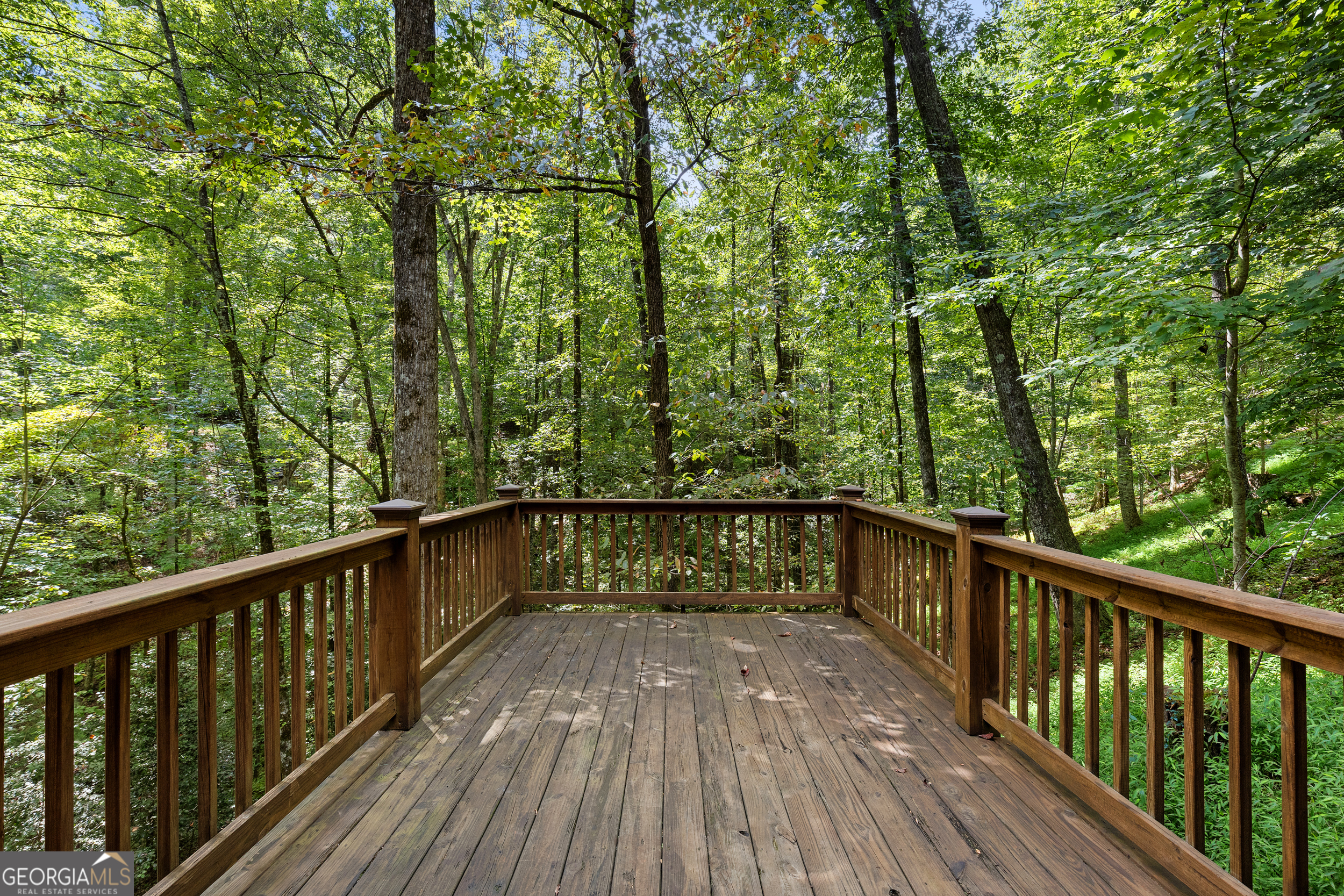 224 Dragon Tree Lane Lakemont, GA 30552 - Photo 30 of 38 a view of balcony with deck and trees