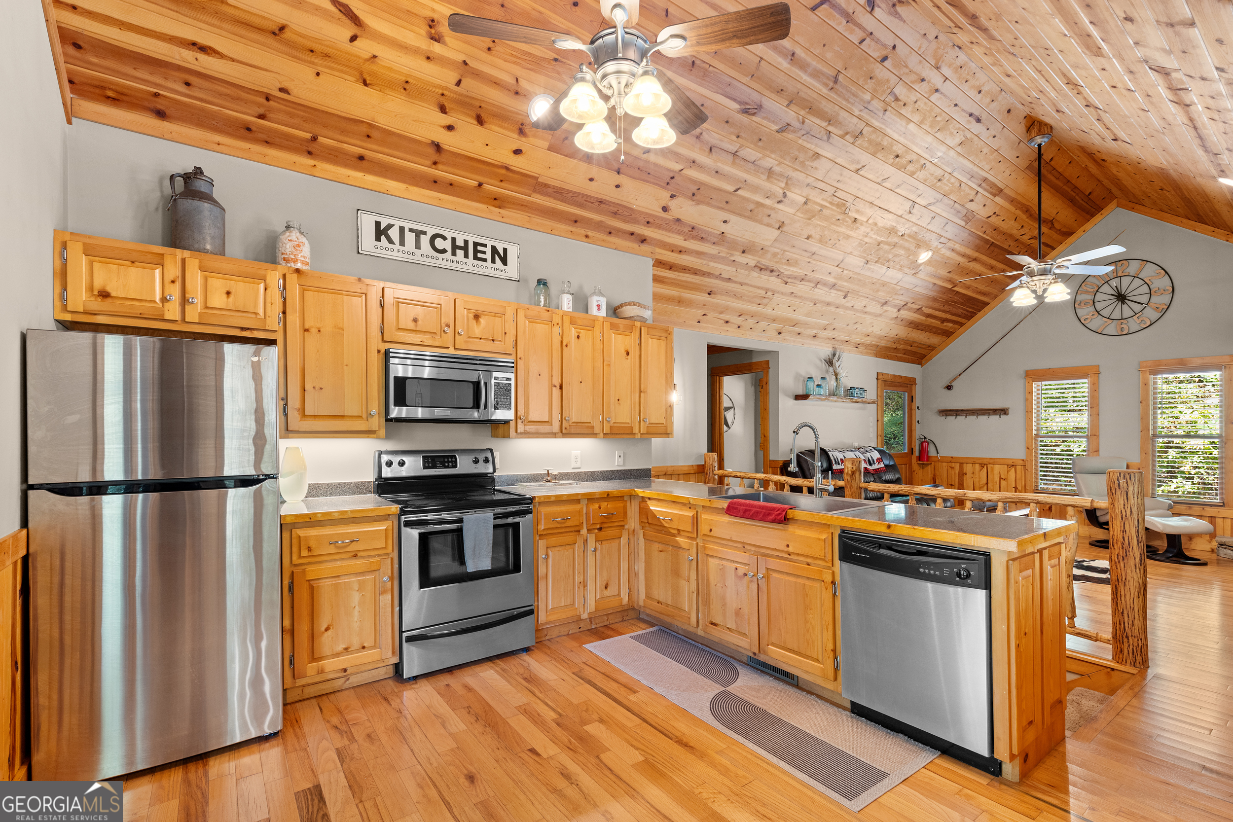 224 Dragon Tree Lane Lakemont, GA 30552 - Photo 7 of 38 a kitchen with stainless steel appliances granite countertop a stove a sink and a refrigerator