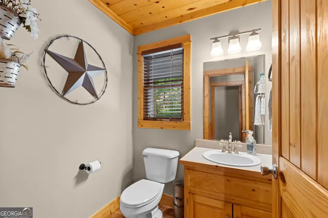 a bedroom with a large bed and a large window