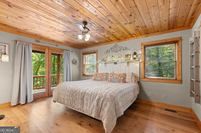 a bedroom with a large bed and a window