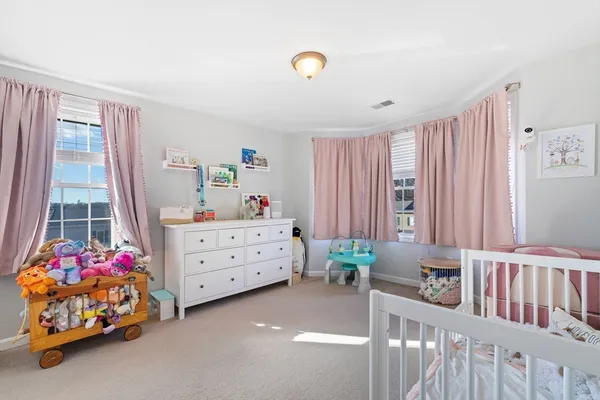 a room with toys and dresser