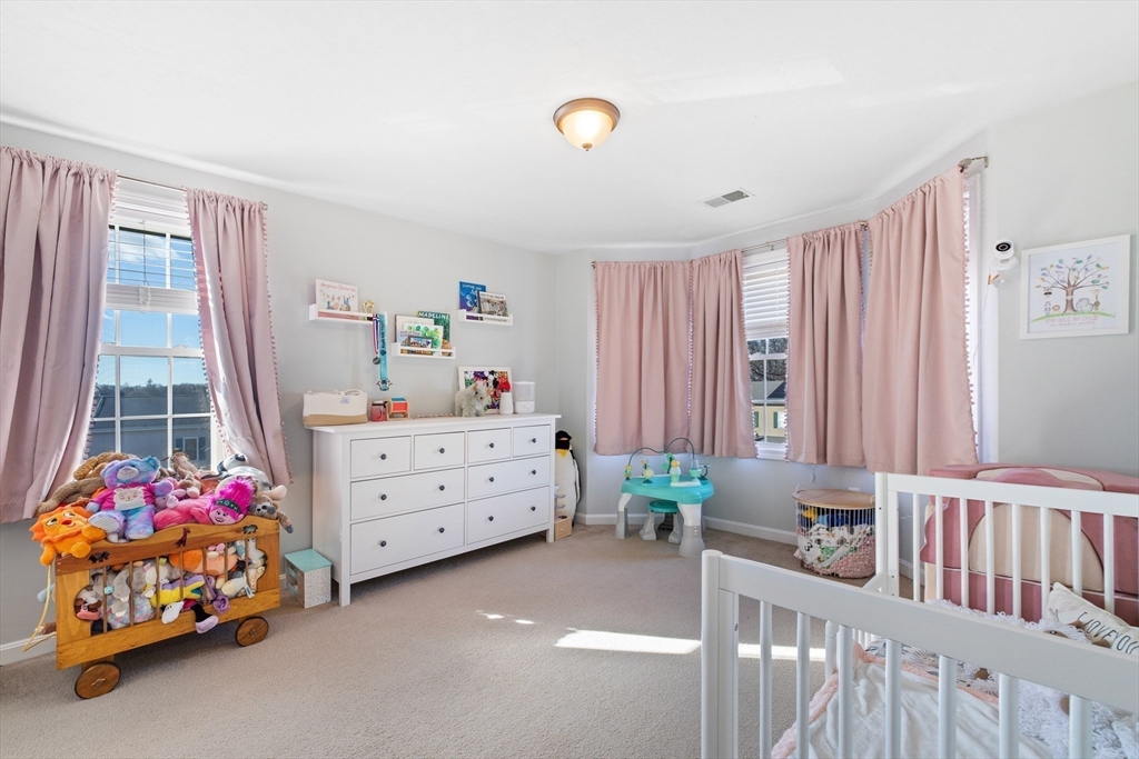 72 Sophia Drive Worcester, MA 01607 - Photo 19 of 25 a bedroom with a bed and a window