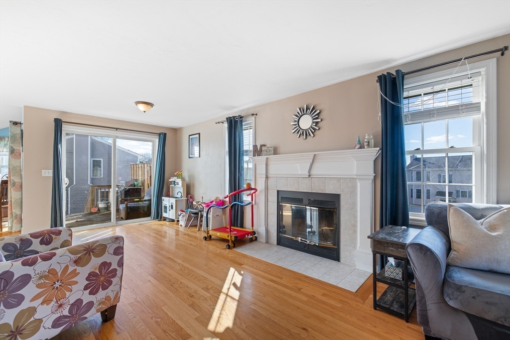 72 Sophia Drive Worcester, MA 01607 - Photo 6 of 25 a living room with furniture and a fireplace
