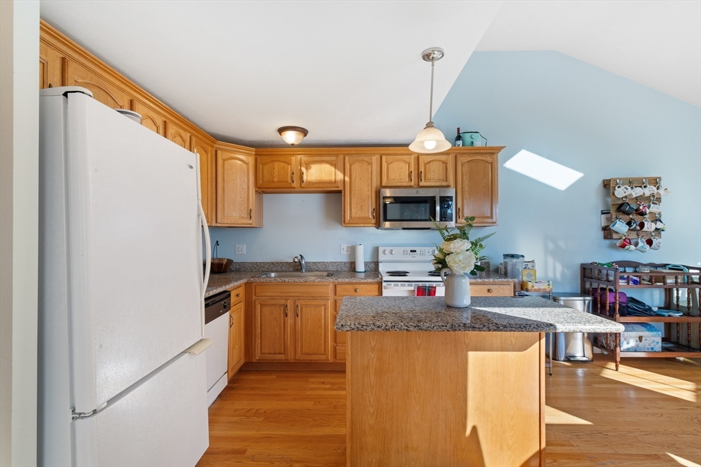 72 Sophia Drive Worcester, MA 01607 - Photo 10 of 25 a kitchen with stainless steel appliances granite countertop a sink stove and refrigerator