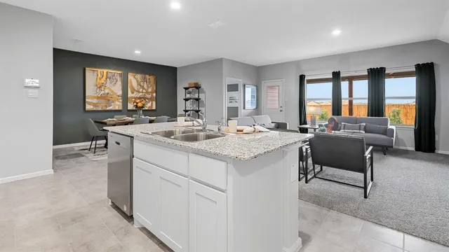 a kitchen with a sink cabinets and microwave