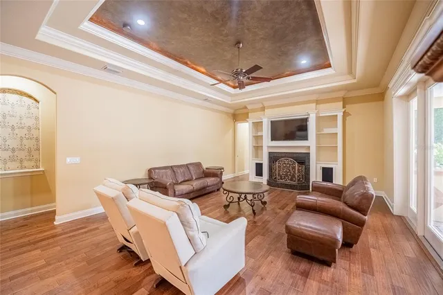 a living room with furniture fireplace and a flat screen tv
