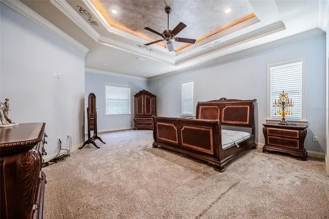 a room with furniture and a ceiling fan