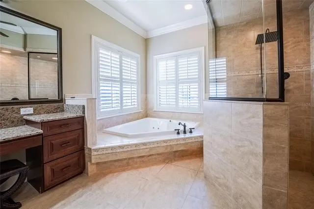 a spacious bathroom with sink and bathtub