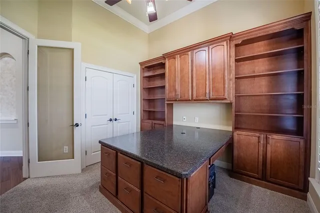 a kitchen with stainless steel appliances granite countertop a sink dishwasher and cabinets with wooden floor