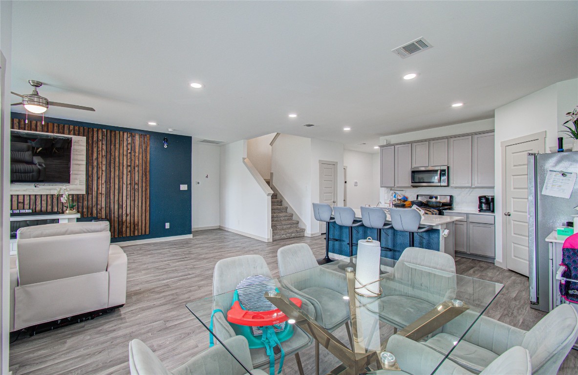 22 Desert Spring Lane Manvel, TX 77578 - Photo 11 of 36 a living room with furniture kitchen and a wooden floor
