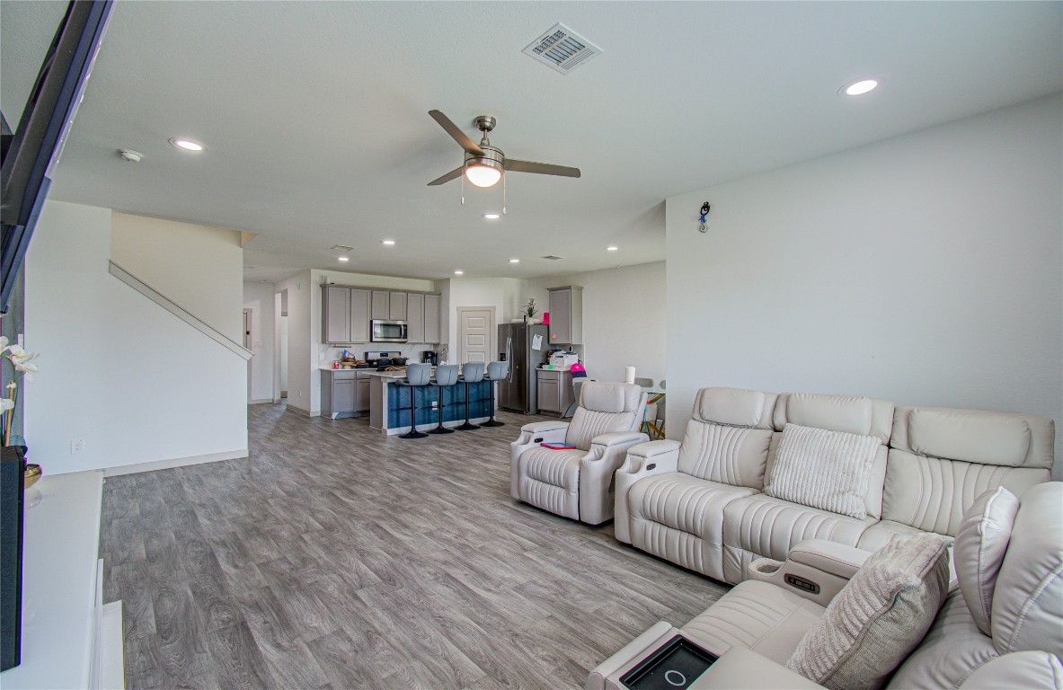 22 Desert Spring Lane Manvel, TX 77578 - Photo 13 of 36 a living room with furniture and kitchen view